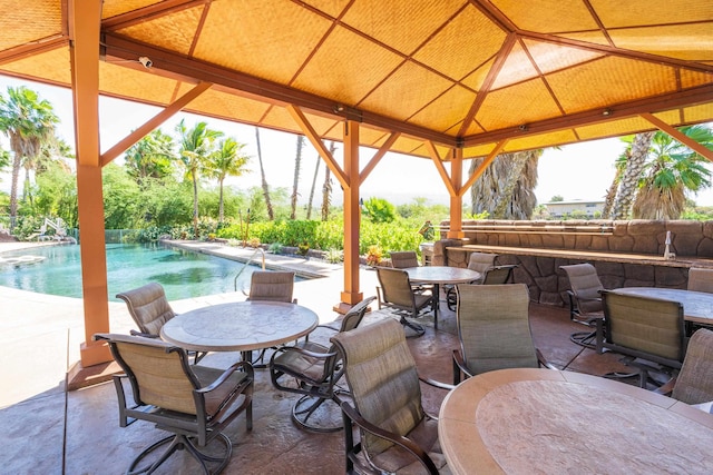 32 Hune One Ln Unit 5-203, Kihei, HI 96753 - view of patio featuring a gazebo, outdoor dining area, and an outdoor pool