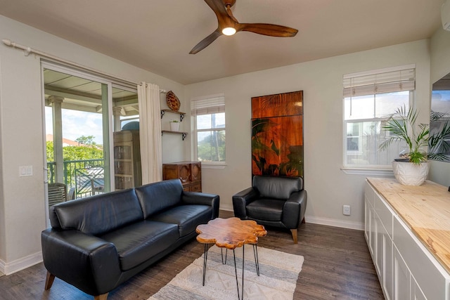 32 Hune One Ln Unit 5-203, Kihei, HI 96753 - living area with ceiling fan, dark wood-style floors, baseboards, and a wall unit AC