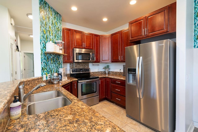32 Hune One Ln Unit 5-203, Kihei, HI 96753 - kitchen featuring appliances with stainless steel finishes, a sink, light tile patterned floors, dark brown cabinets, and recessed lighting