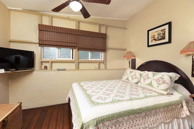 bedroom featuring ceiling fan and dark wood finished floors