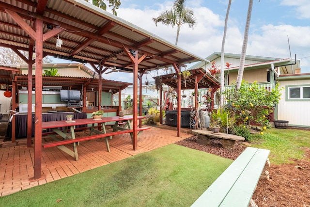 view of yard with a patio area and a hot tub