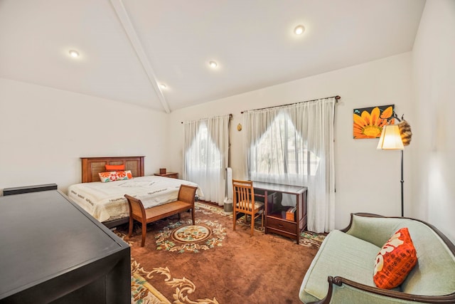 carpeted bedroom with vaulted ceiling