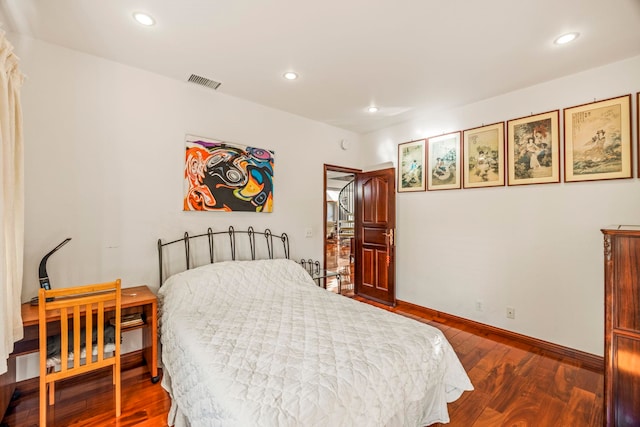 bedroom featuring dark hardwood / wood-style floors