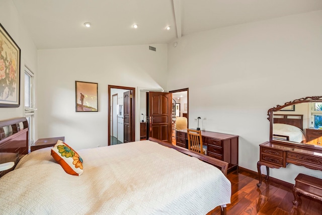 bedroom with dark hardwood / wood-style flooring and high vaulted ceiling