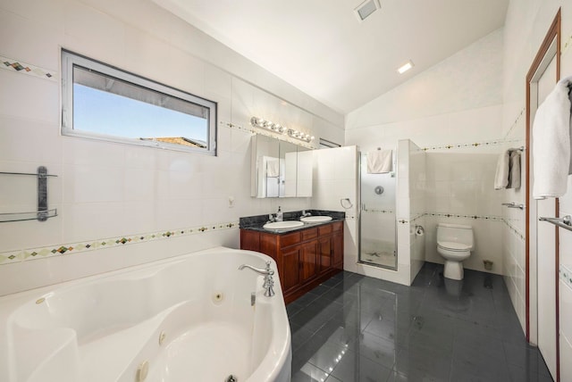 full bathroom with tile patterned floors, separate shower and tub, tile walls, toilet, and lofted ceiling