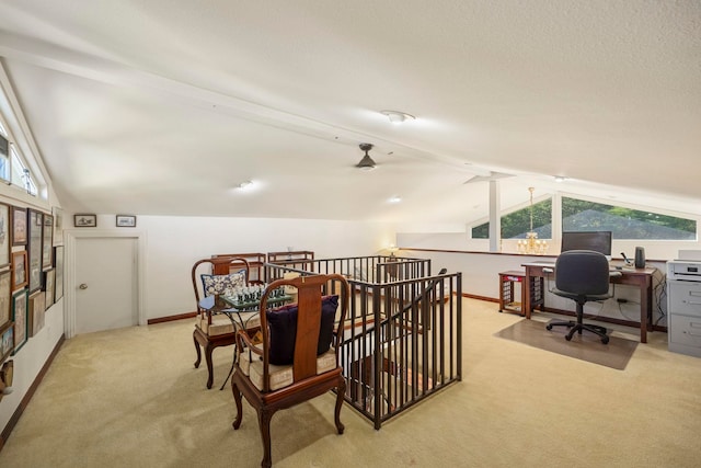 office with lofted ceiling with beams, ceiling fan, and light colored carpet