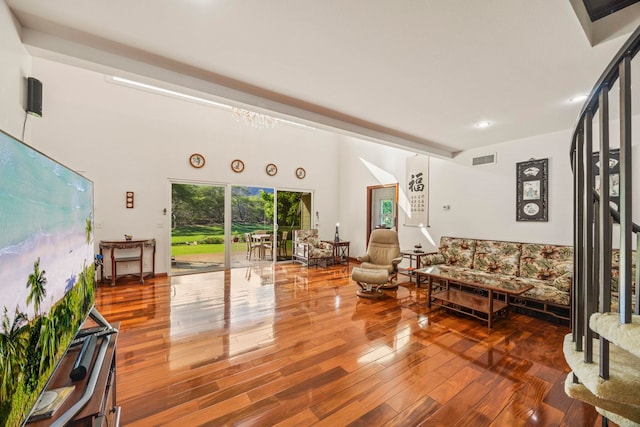 living room with a chandelier and hardwood / wood-style flooring