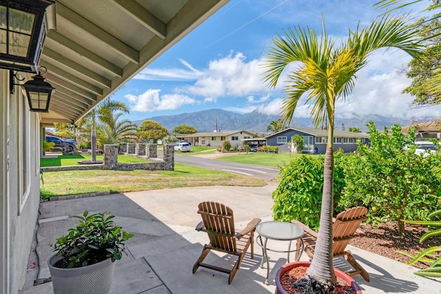 view of patio / terrace with a mountain view