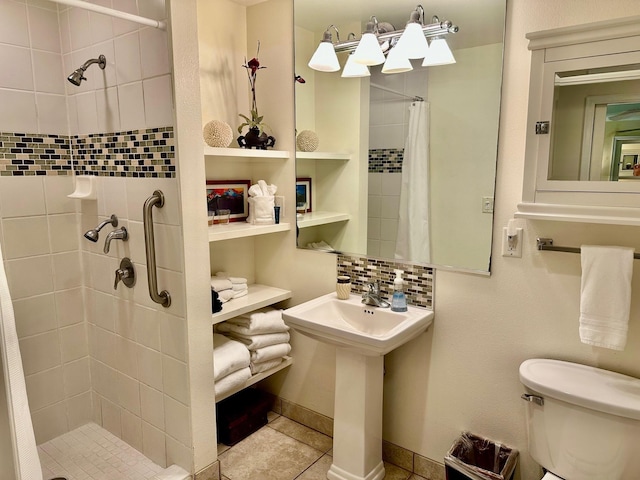 bathroom with walk in shower, decorative backsplash, tile patterned floors, and toilet