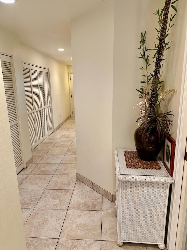 hall with light tile patterned flooring