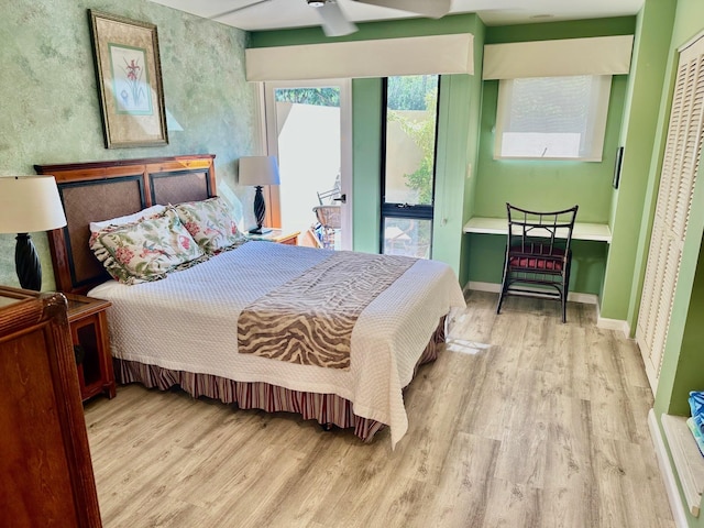 bedroom featuring light hardwood / wood-style flooring and ceiling fan