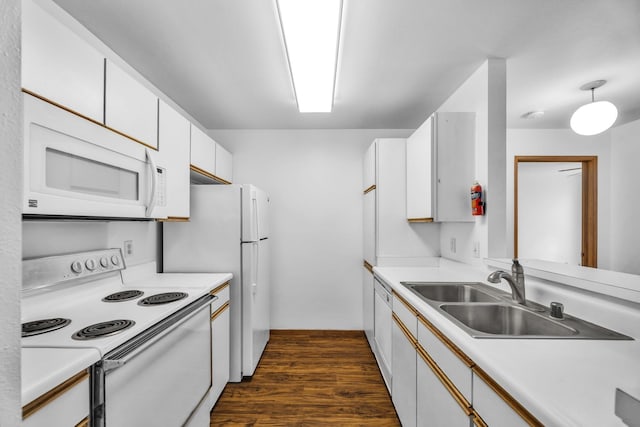 36 Kunihi Ln Unit 213, Kahului, HI 96732 - kitchen with white appliances, light countertops, dark wood-style flooring, a sink, and white cabinetry