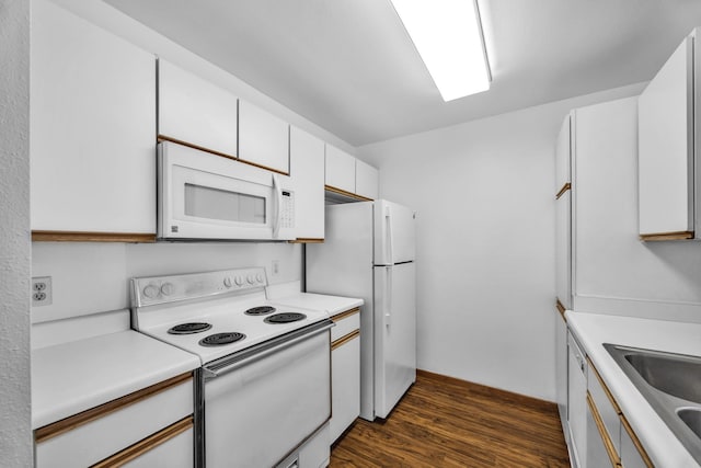 36 Kunihi Ln Unit 213, Kahului, HI 96732 - kitchen featuring white appliances, light countertops, and dark wood finished floors