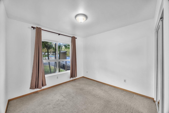 36 Kunihi Ln Unit 213, Kahului, HI 96732 - empty room with baseboards and carpet floors