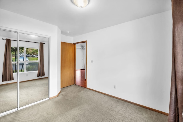 36 Kunihi Ln Unit 213, Kahului, HI 96732 - unfurnished bedroom with a closet, carpet floors, and baseboards