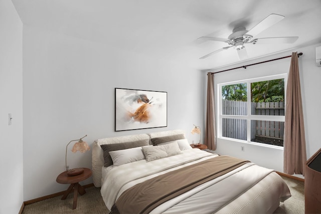 36 Kunihi Ln Unit 213, Kahului, HI 96732 - bedroom with baseboards, a wall mounted air conditioner, a ceiling fan, and carpet floors