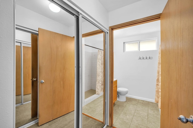 36 Kunihi Ln Unit 213, Kahului, HI 96732 - bathroom featuring toilet and curtained shower