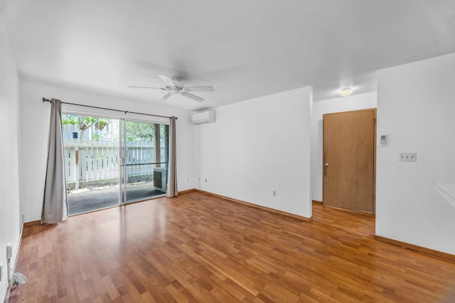 36 Kunihi Ln Unit 213, Kahului, HI 96732 - empty room with baseboards, wood finished floors, a ceiling fan, and an AC wall unit