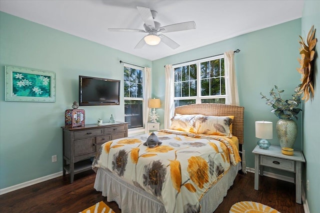 bedroom with dark wood finished floors, baseboards, and ceiling fan