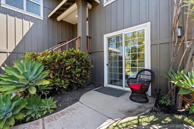 doorway to property featuring board and batten siding