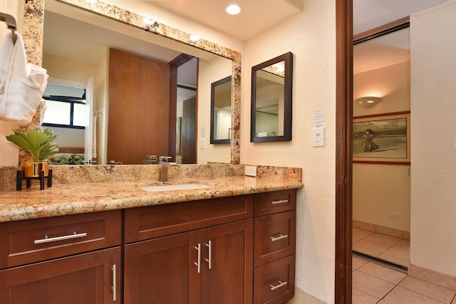 bathroom featuring vanity and tile floors