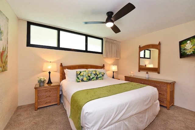 bedroom with ceiling fan and carpet