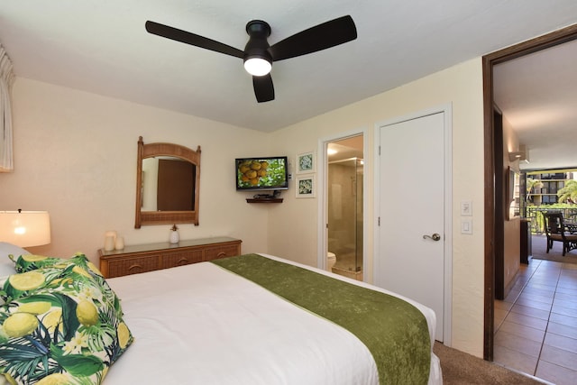 bedroom with connected bathroom, tile floors, and ceiling fan