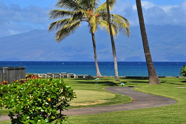 view of nearby features featuring a water view and a yard