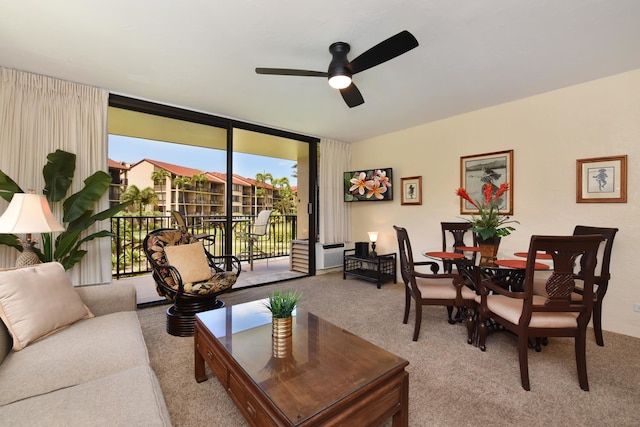 living room with ceiling fan and carpet floors