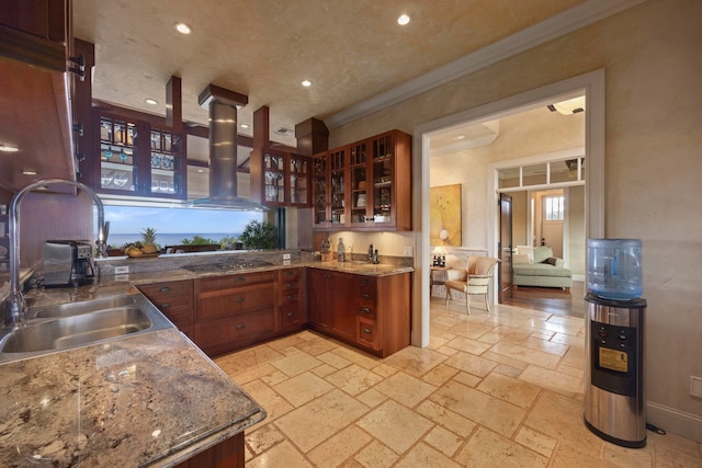 kitchen featuring light tile flooring, ornamental molding, wall chimney exhaust hood, black electric stovetop, and sink