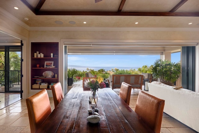 tiled dining space with ornamental molding and beam ceiling