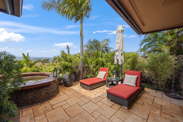 view of patio featuring a jacuzzi