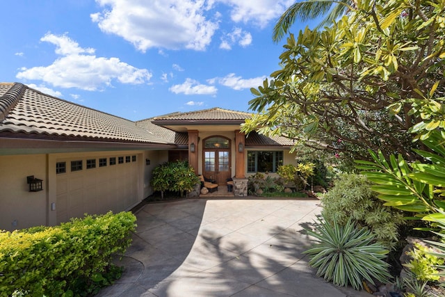 view of front of house with french doors and a garage