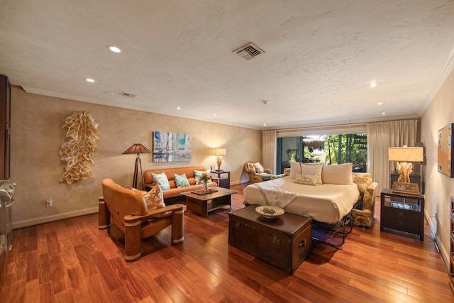 bedroom featuring wood-type flooring and ornamental molding