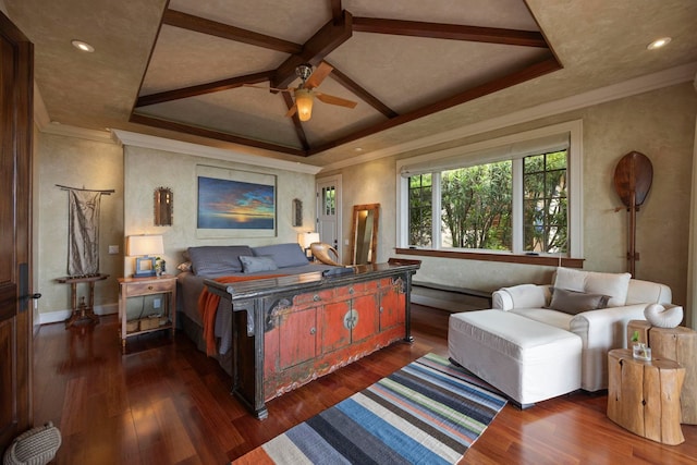 bedroom with a tray ceiling, ceiling fan, dark hardwood / wood-style floors, and crown molding