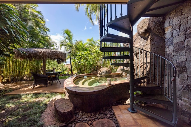 view of patio featuring an outdoor hot tub