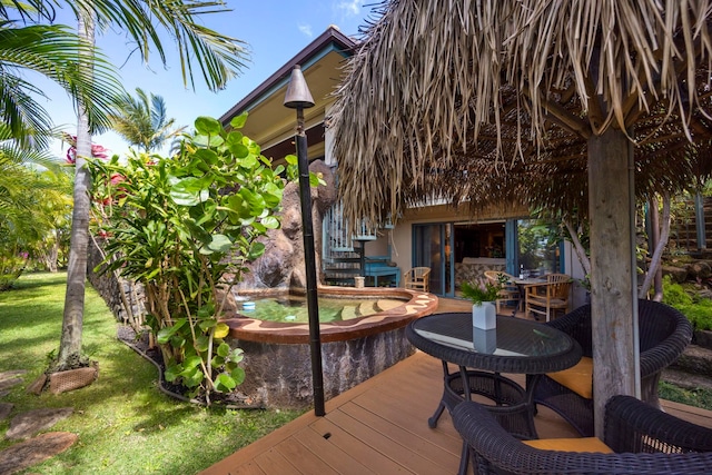 wooden deck featuring a yard