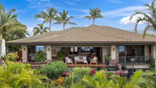 rear view of house featuring an outdoor living space