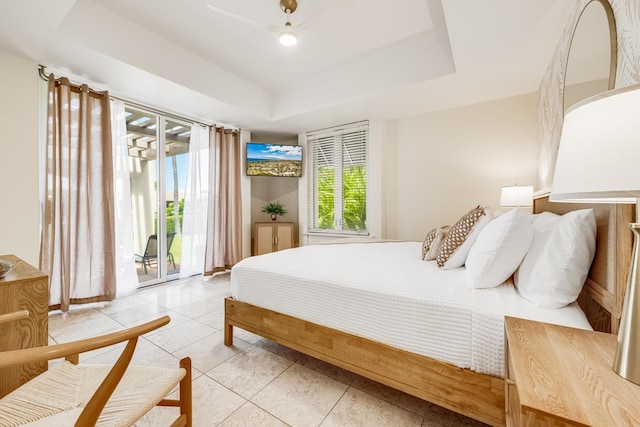3200 Wailea Alanui Dr Unit 2105, Kihei, HI 96753 - bedroom featuring access to outside, light tile patterned flooring, and a tray ceiling