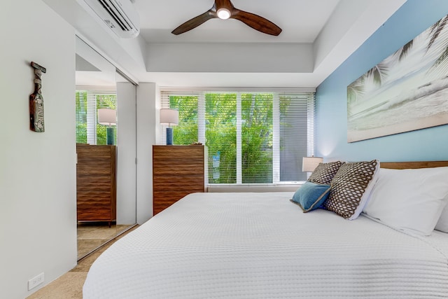3200 Wailea Alanui Dr Unit 2105, Kihei, HI 96753 - carpeted bedroom with a wall mounted air conditioner and ceiling fan