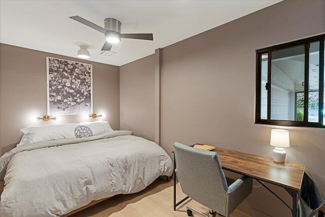 bedroom featuring light wood-type flooring and ceiling fan