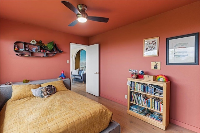 bedroom featuring hardwood / wood-style floors and ceiling fan