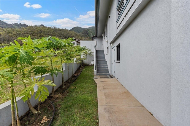 view of side of property with a mountain view