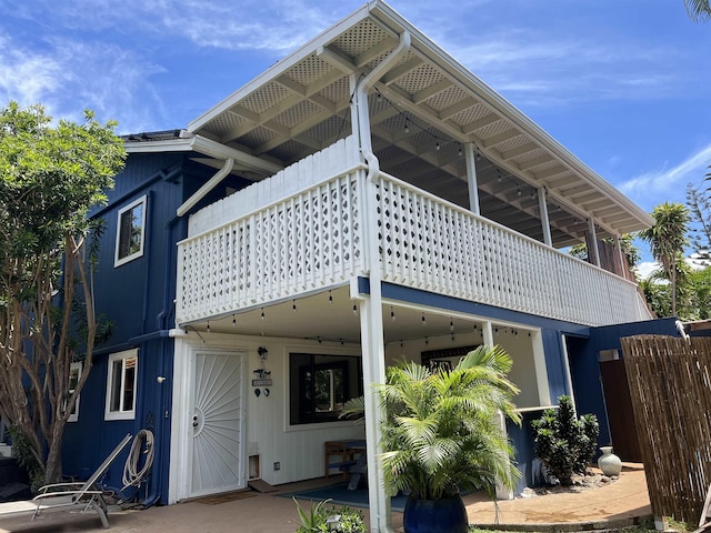 rear view of house with a balcony