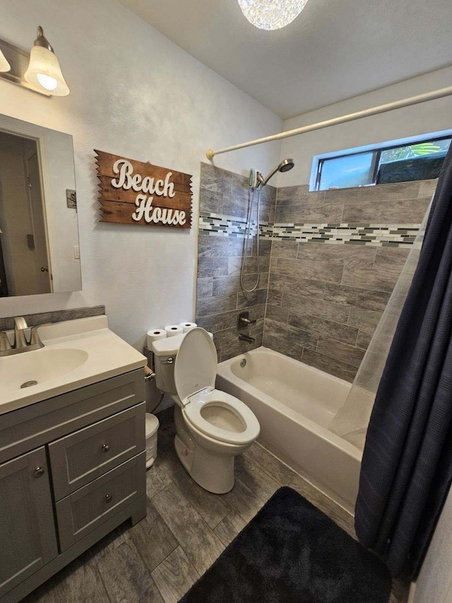 bathroom featuring toilet, shower / tub combo, wood finished floors, and vanity