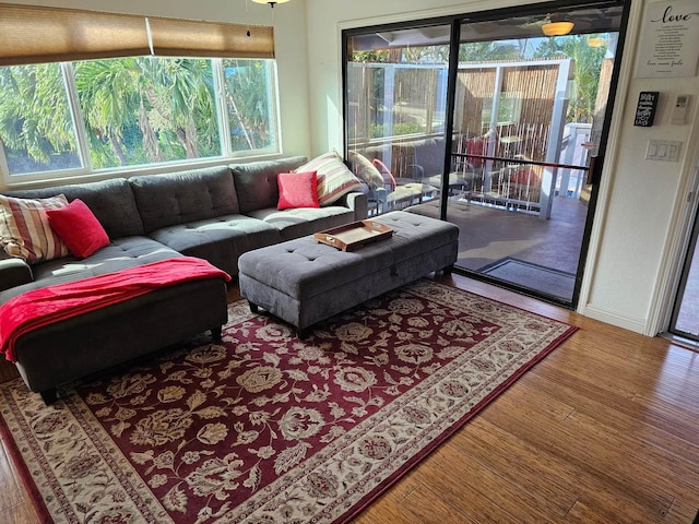 living area featuring wood finished floors and baseboards