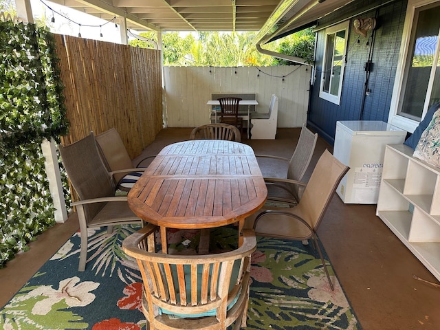 view of patio / terrace featuring outdoor dining space and fence