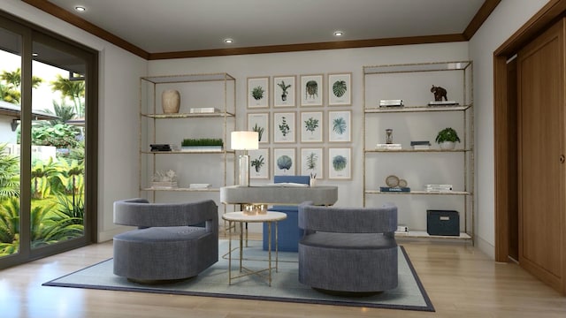 living area with light hardwood / wood-style flooring and ornamental molding