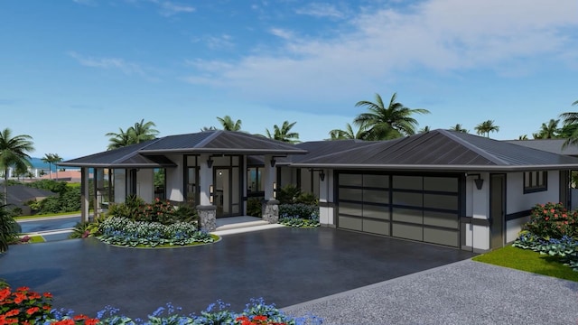 view of front of property with covered porch and a garage