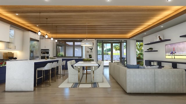 living room with sink, wooden ceiling, light hardwood / wood-style flooring, and french doors